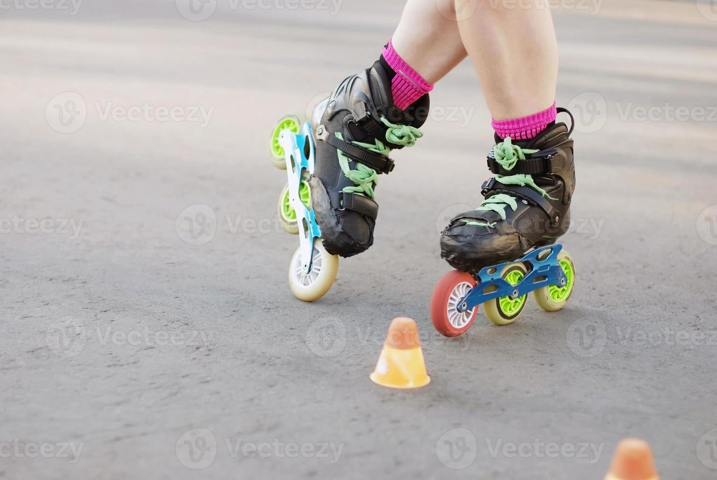 inline roller skating, rollerblading amateur training on asphalt road, photo