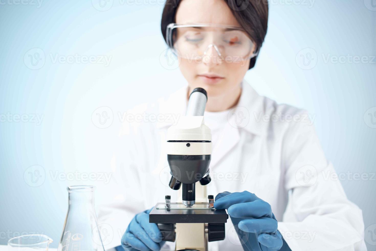 woman laboratory assistant microscope science professional analysis biotechnology photo