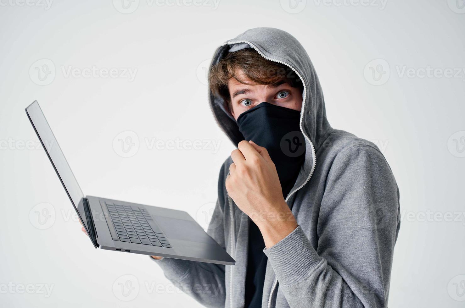 masked man crime anonymity caution balaclava isolated background photo