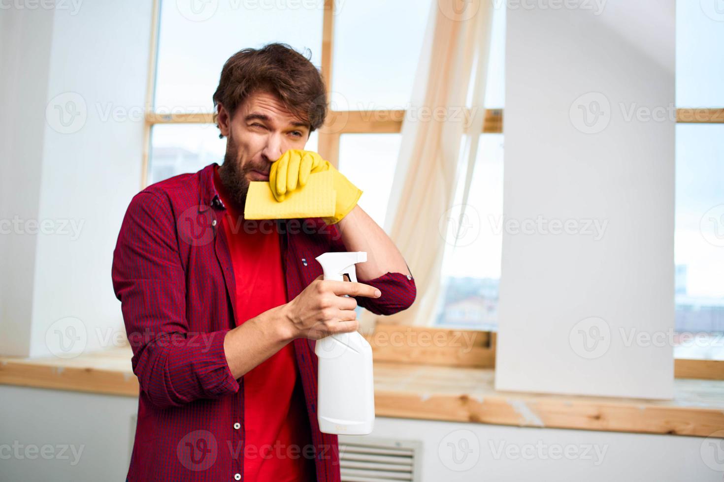 man in red shirt detergent cleaning housework professionals photo