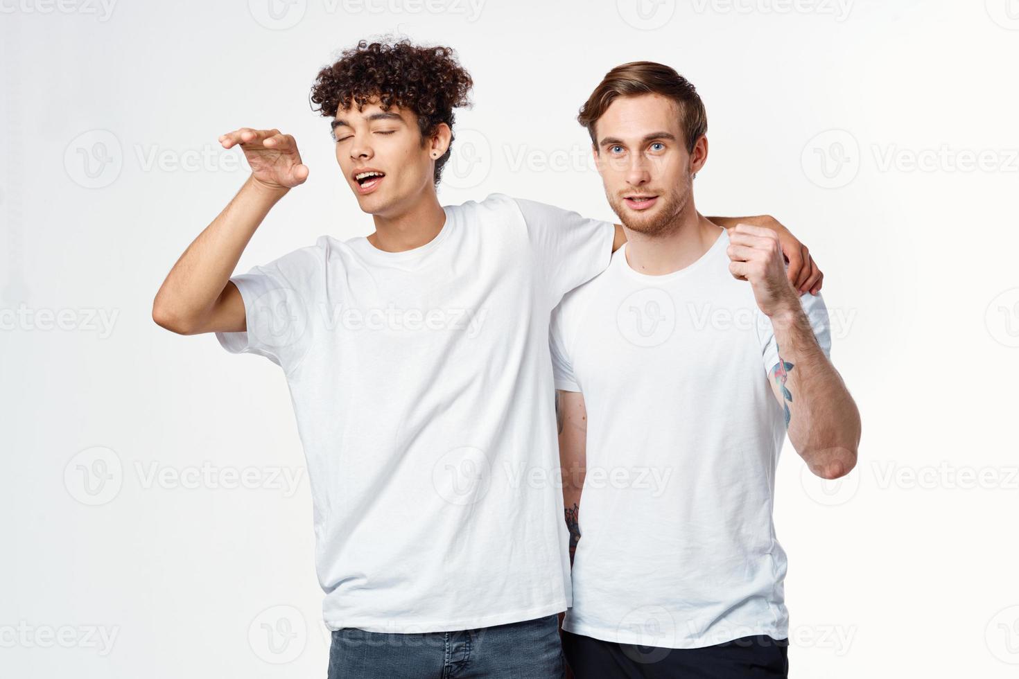 two men are standing next to clean t-shirts emotions photo