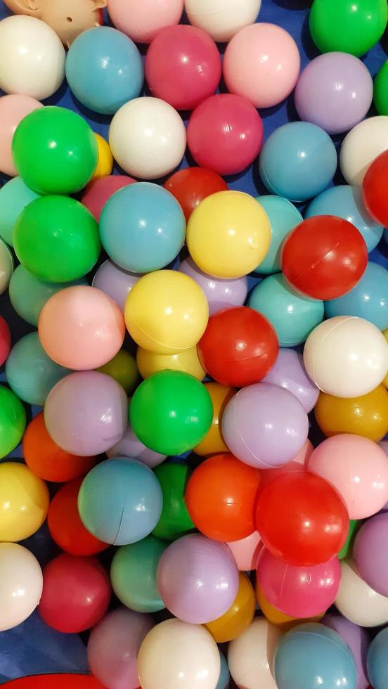 Round colorful plastic balls. Background concept. photo