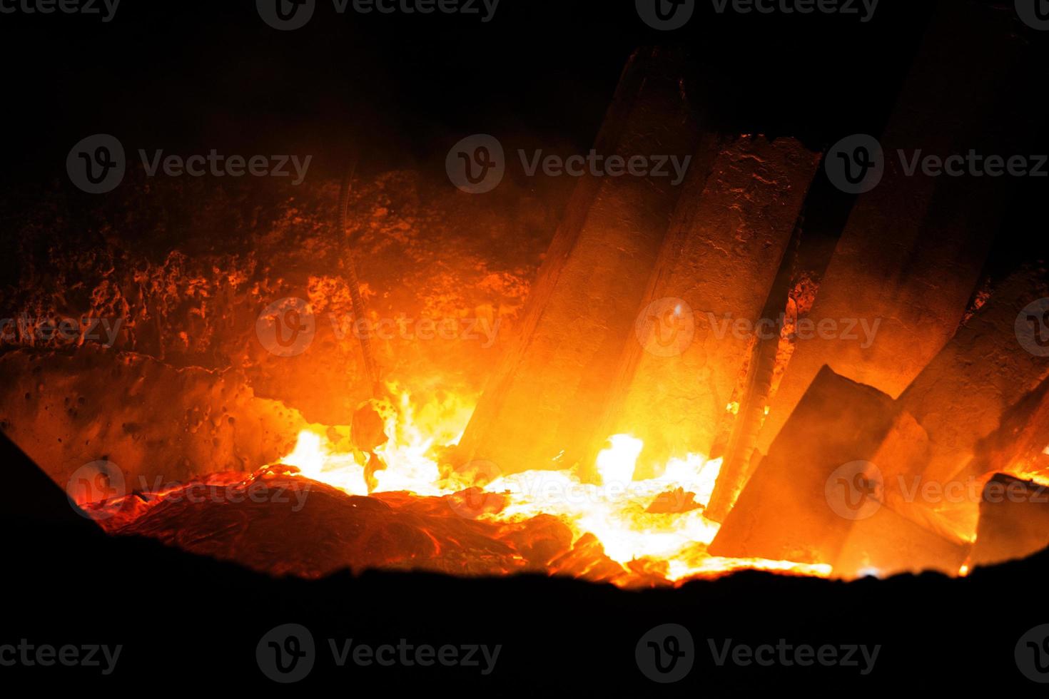 Heated metal pig gets squeezed and drilled at special metal forging unit at Brueck metal forging factory in Demra, Dhaka, Bangladesh. photo