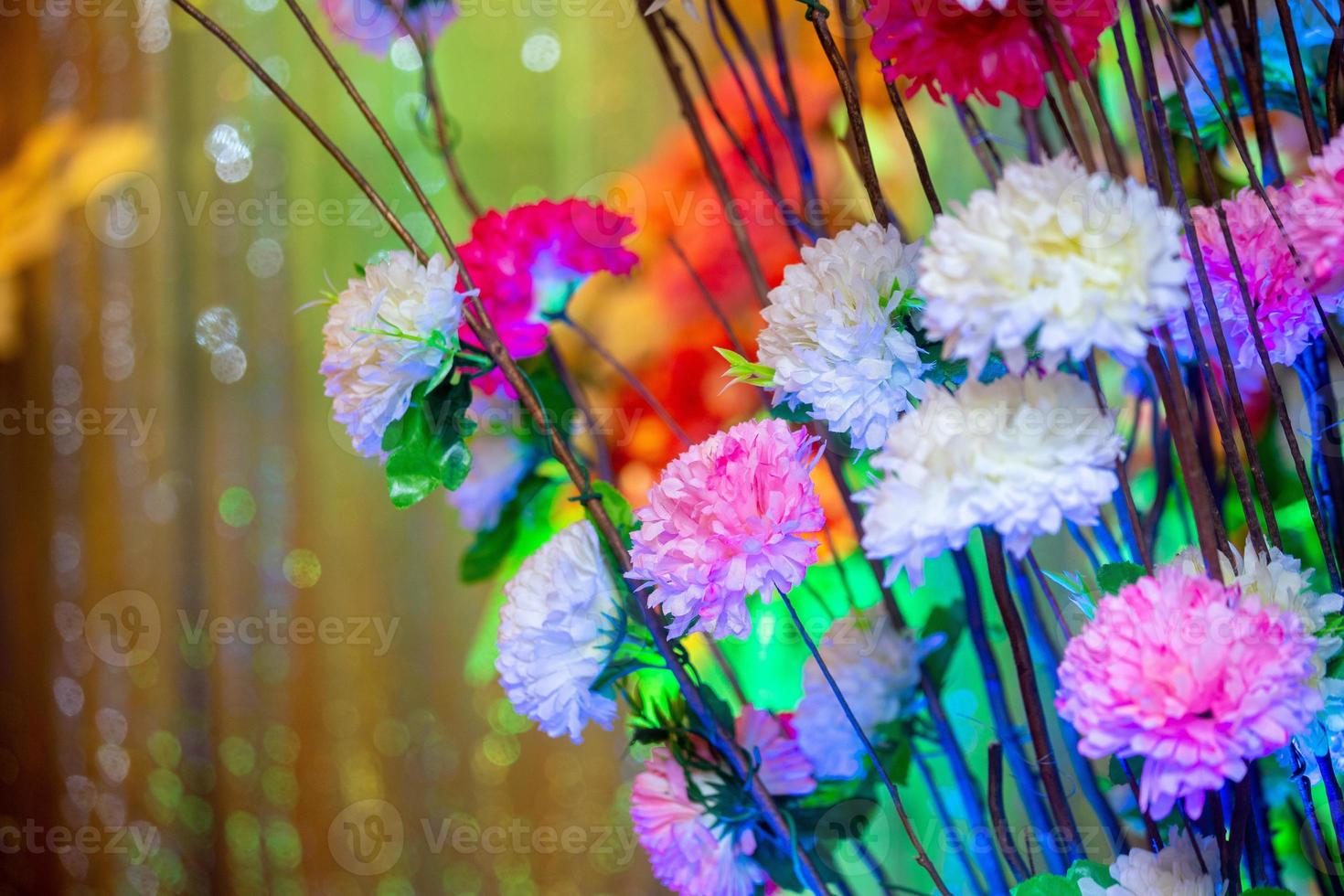 Hand made paper flower stick and colorful lighting. photo