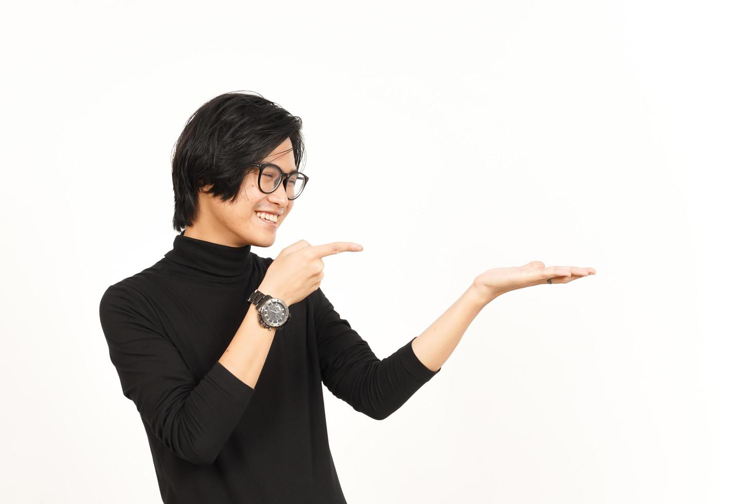 Showing, Presenting and Holding Product on Open Palm Of Handsome Asian Man Isolated On White photo