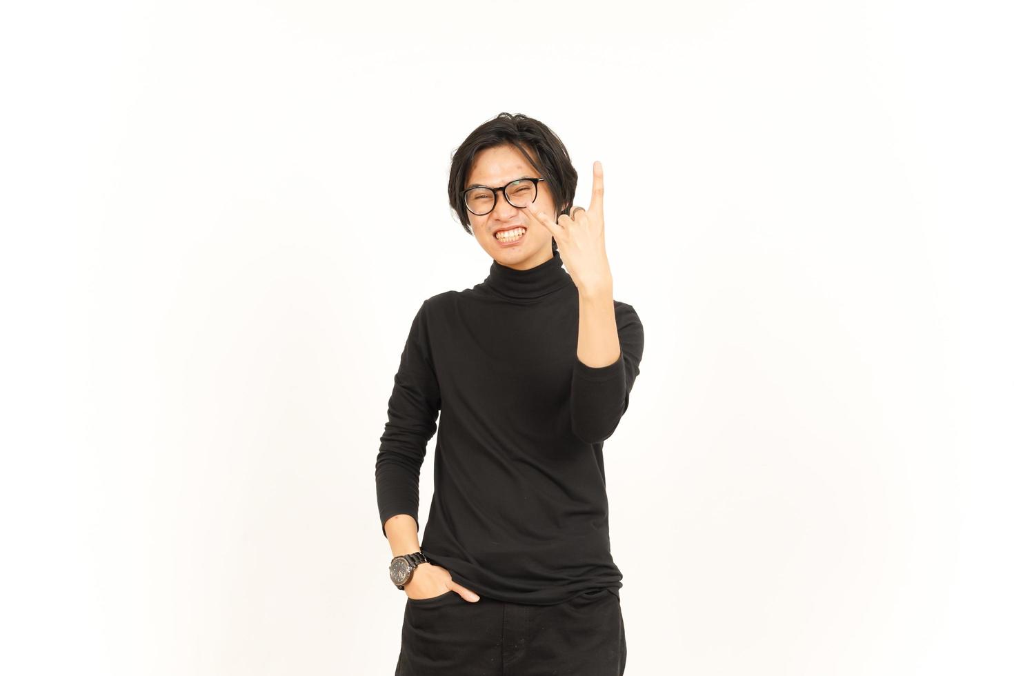 Showing Metal Hand Sign Of Handsome Asian Man Isolated On White Background photo