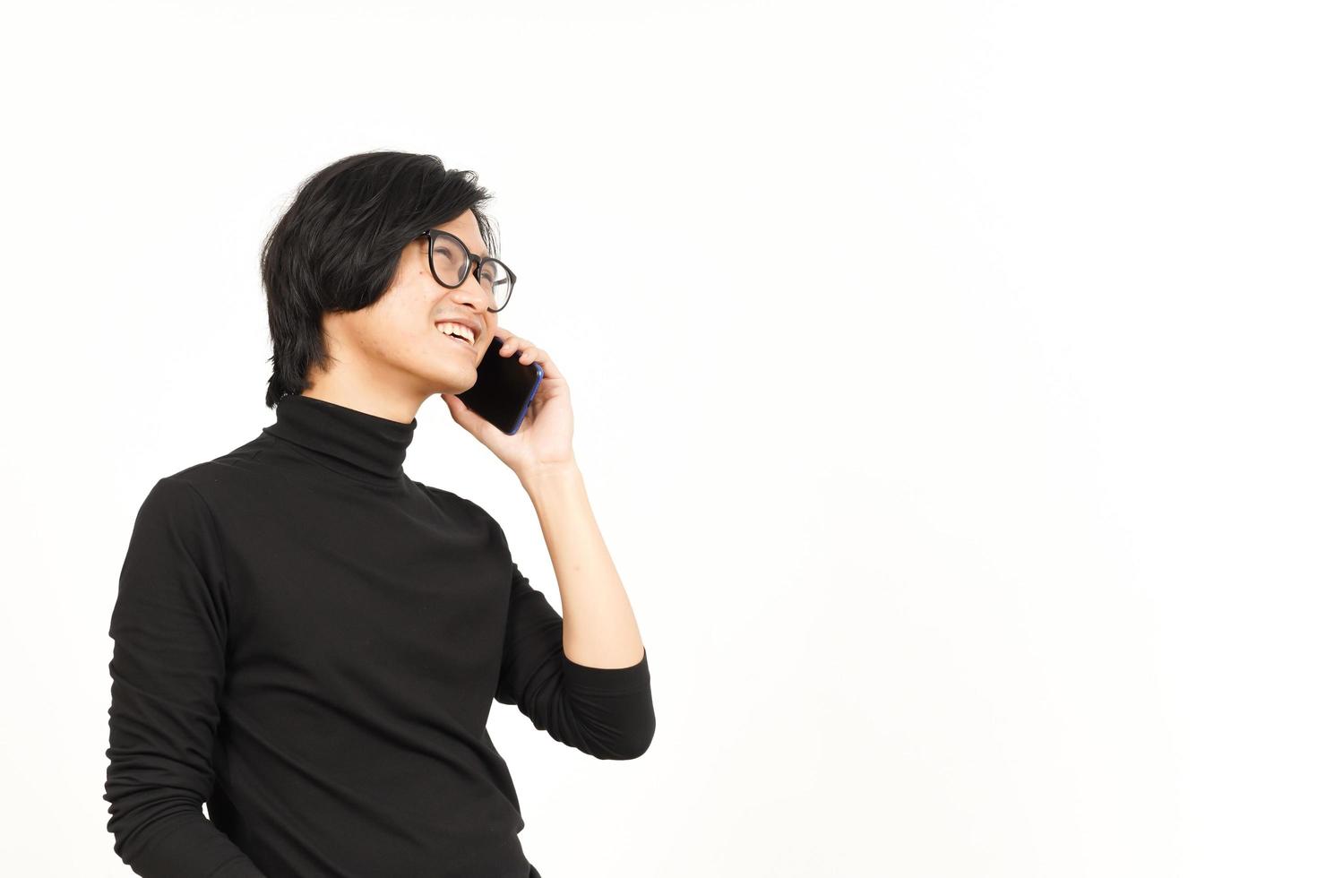 Make a Phone Call Using smartphone with smile face Of Handsome Asian Man Isolated On White photo