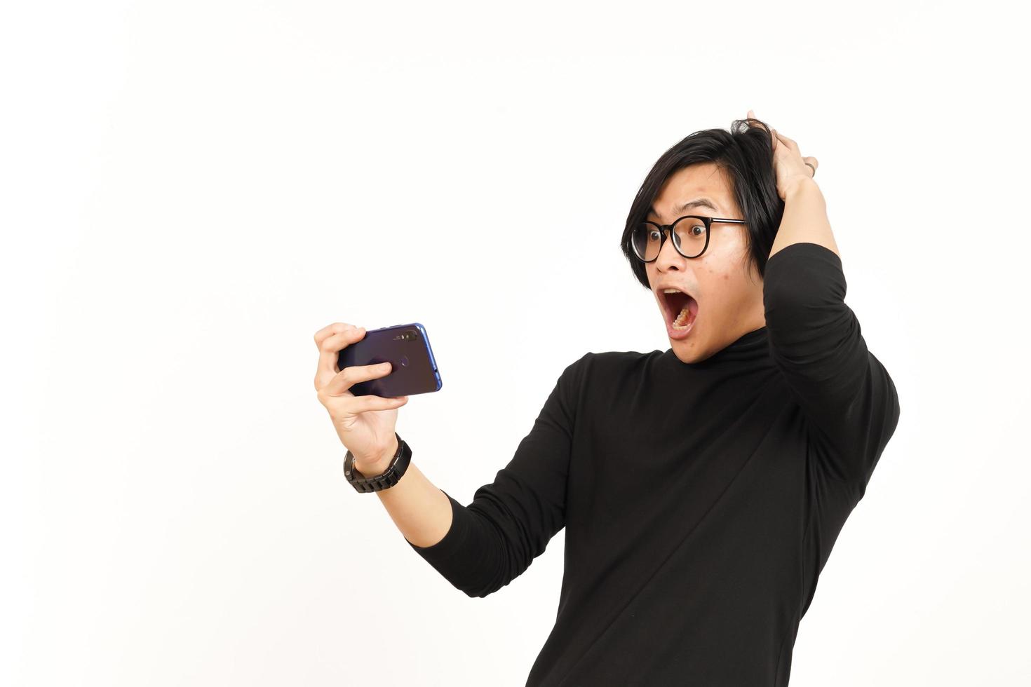 Playing Mobile Game on Smartphone Of Handsome Asian Man Isolated On White Background photo