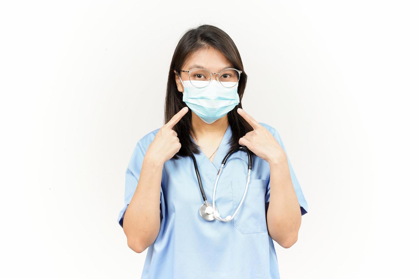 Wearing Medical Mask for Preventing Corona Virus Of Asian Young Doctor Isolated On White Background photo