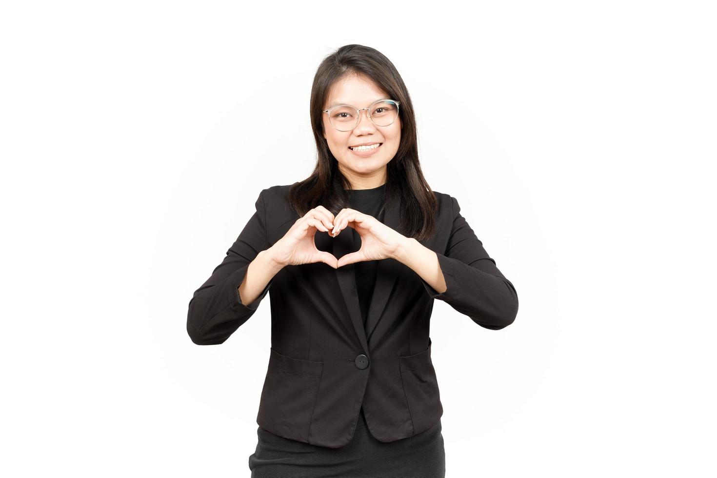 Showing Love Sign Of Beautiful Asian Woman Wearing Black Blazer Isolated On White Background photo