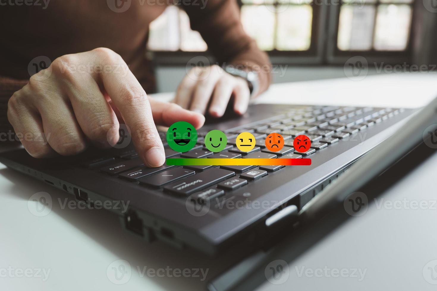 Concept of customer satisfaction and service, businesswoman using laptop to express their opinions, answers and satisfied scores. photo