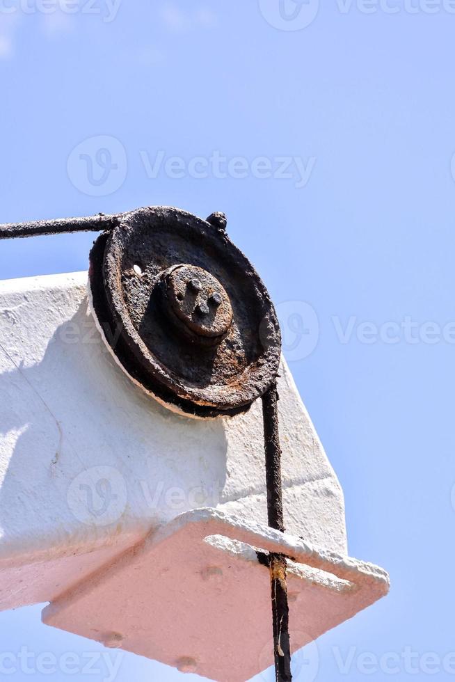 Rusty metal pulley photo