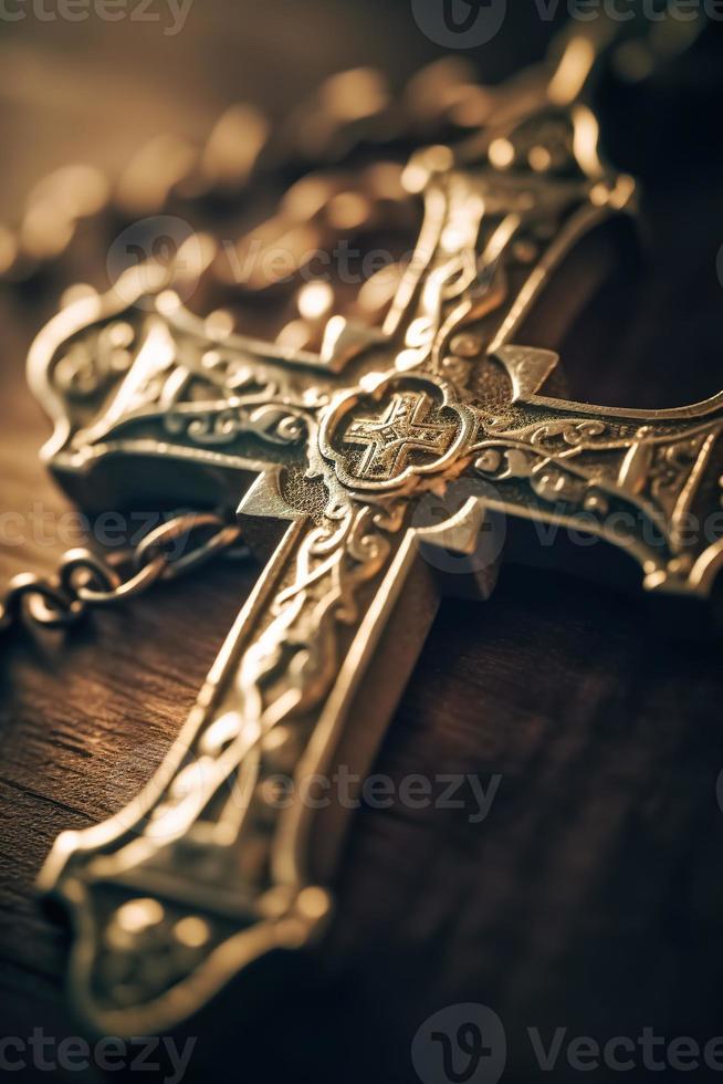 Close-up of a silver cross on a wooden table, shallow depth of field photo