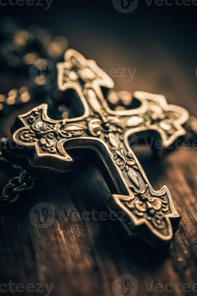 Close-up of a silver cross on a wooden table, shallow depth of field photo