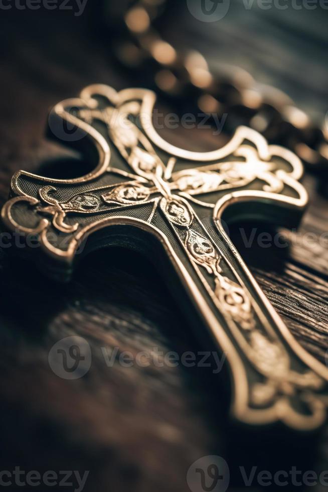 Close-up of a silver cross on a wooden table, shallow depth of field photo