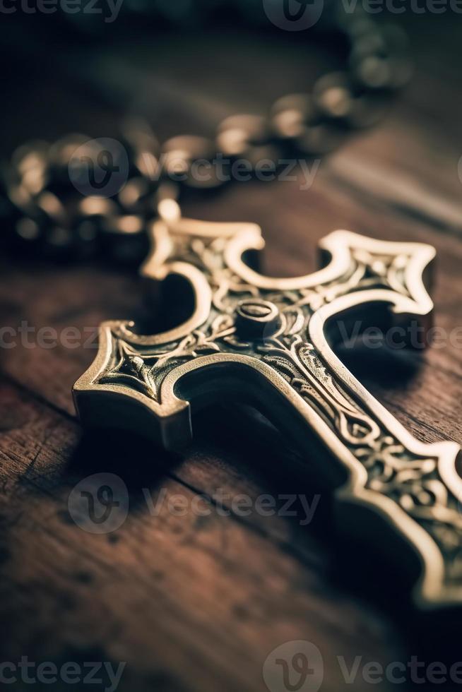 Close-up of a silver cross on a wooden table, shallow depth of field photo