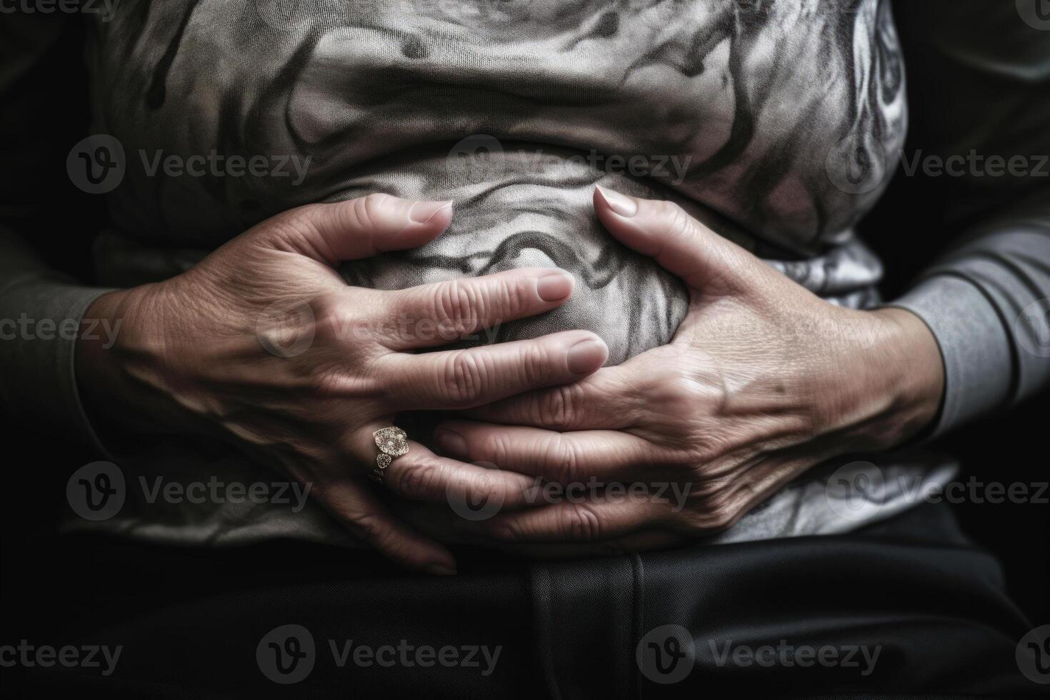 woman holding hands on her belly, stabbing pain in abdomen diarrhea photo