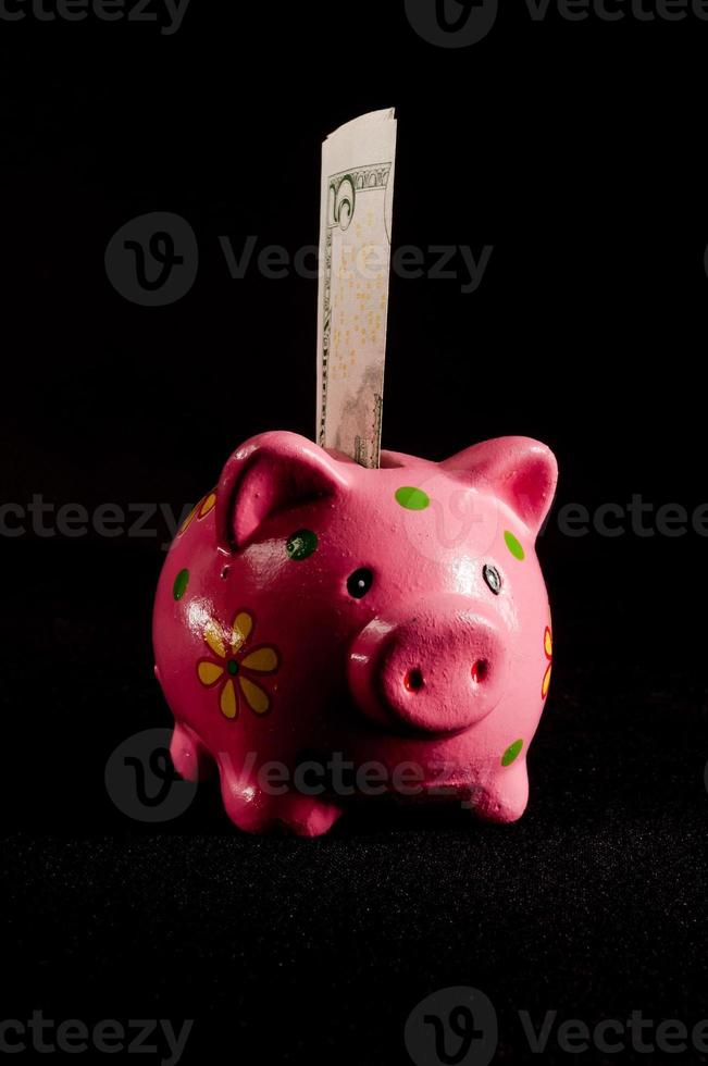 Piggy bank on black background photo