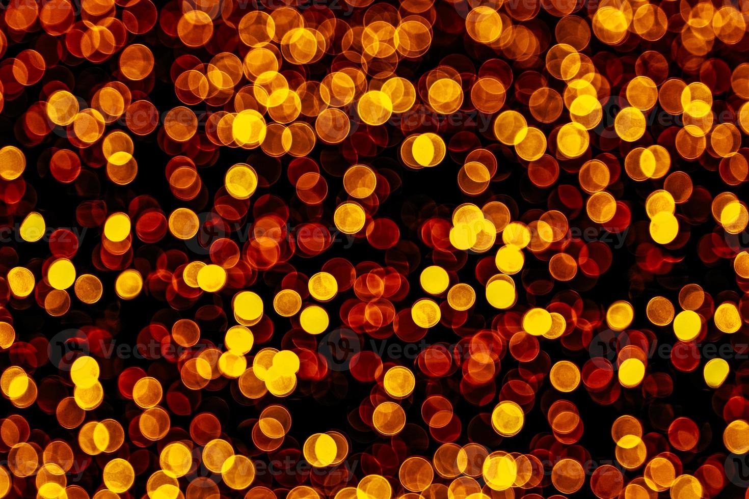 abstract bokeh background of golden light burst made from bokeh motion. photo