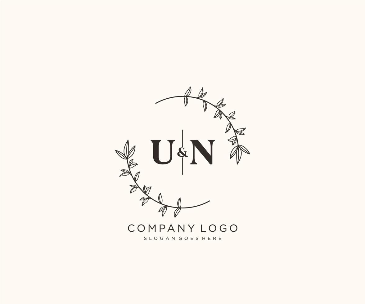 initial UN letters Beautiful floral feminine editable premade monoline logo suitable for spa salon skin hair beauty boutique and cosmetic company. vector