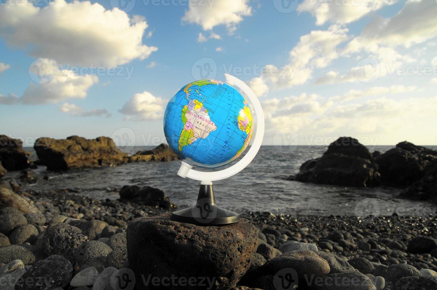 Globe on a rock photo