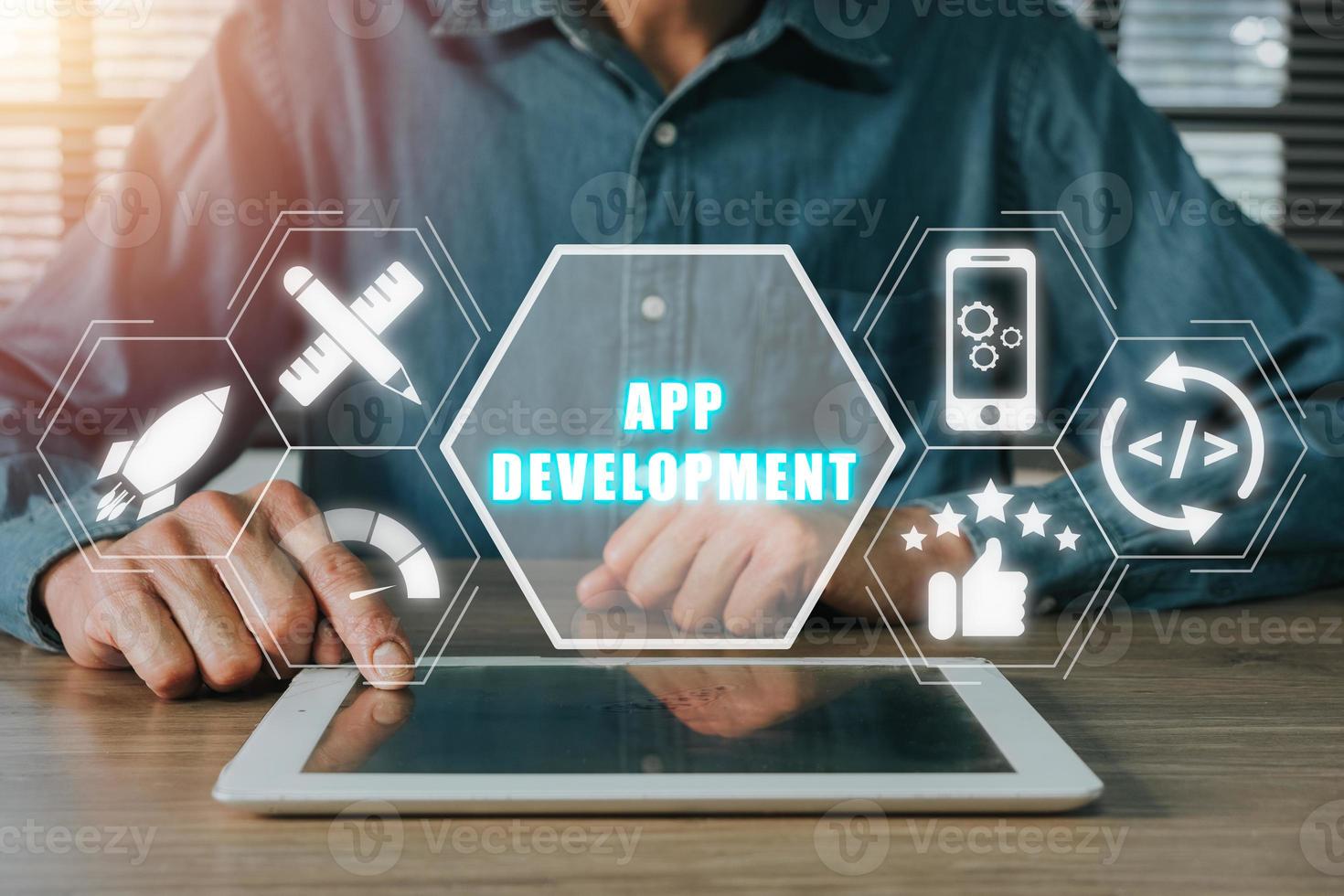 App development concept, Person hand using digital tablet with app development icon on virtual screen background, Designing application for mobile phone. photo