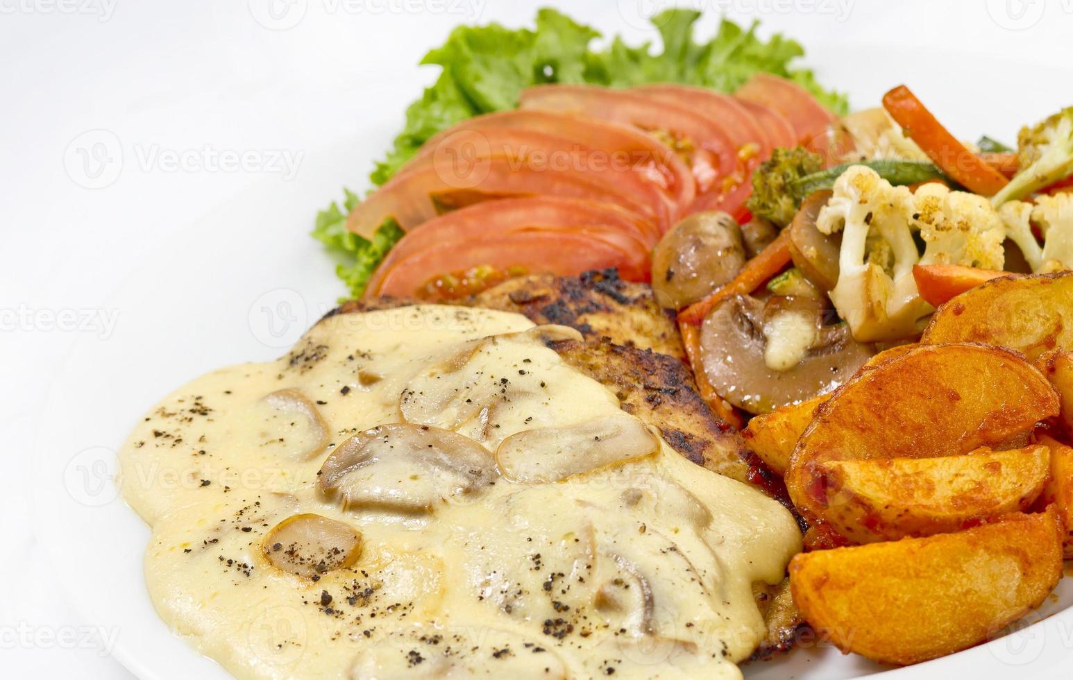 Peri peri Chicken with Button mushroom gravy, Saute Vegetables, Spicy fried Potatoes with Tomato Lettuce Salad. photo