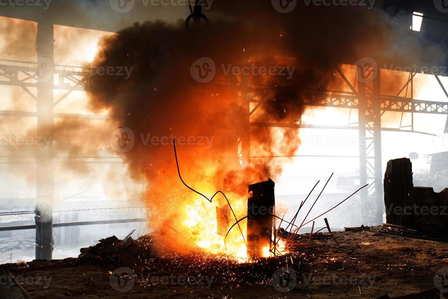 Scrap steel melts down in an induction furnace at Demra, Dhaka, Bangladesh. photo