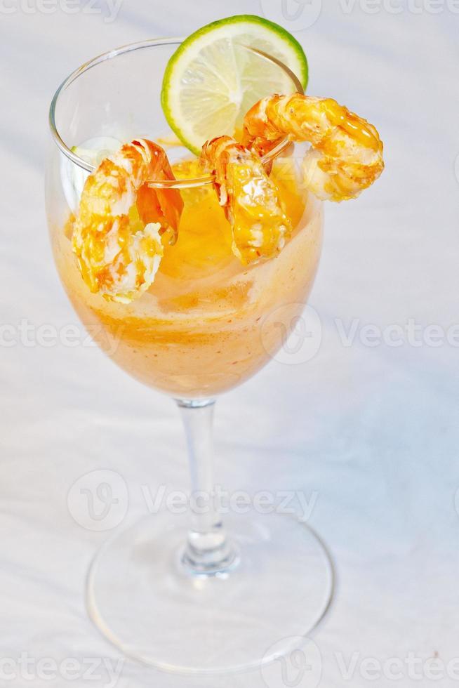 A glass of mouthful tasty Shrimp Cocktail Appetizer. photo