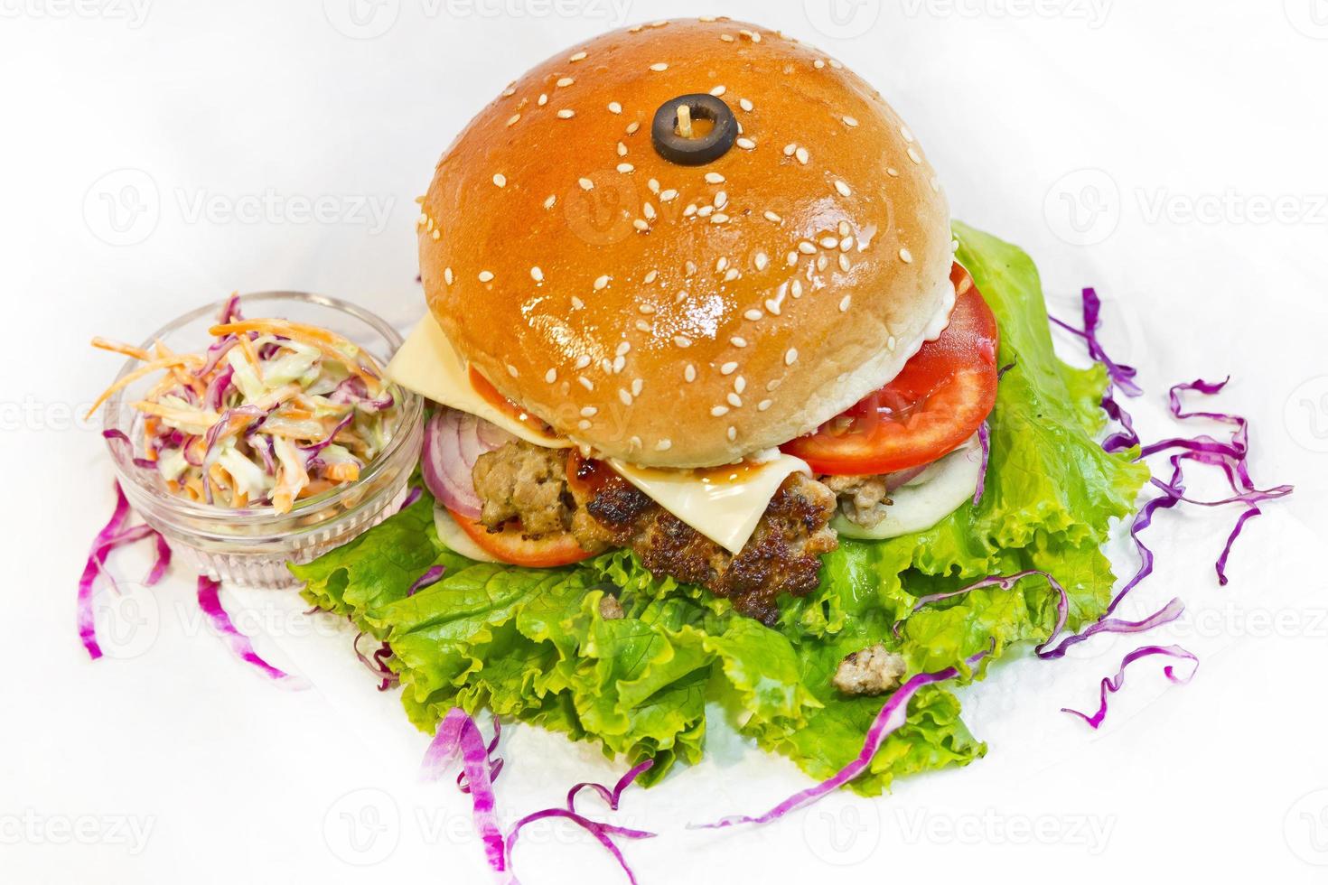 A big size Burger Patties from Ground Beef with Lettuce leaf and Coleslaw Salad. photo