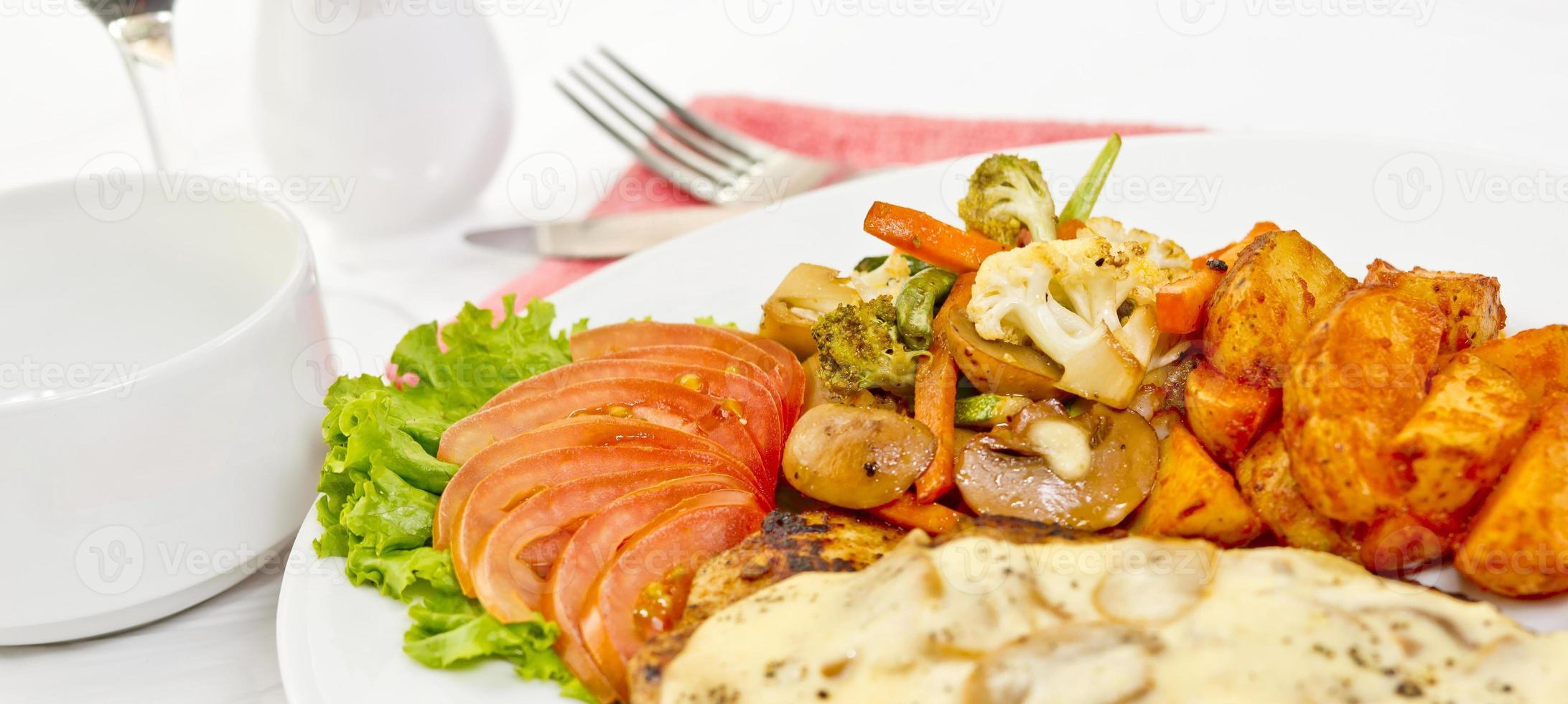 Peri peri Chicken with Button mushroom gravy, Saute Vegetables, Spicy fried Potatoes with Tomato Lettuce Salad. photo