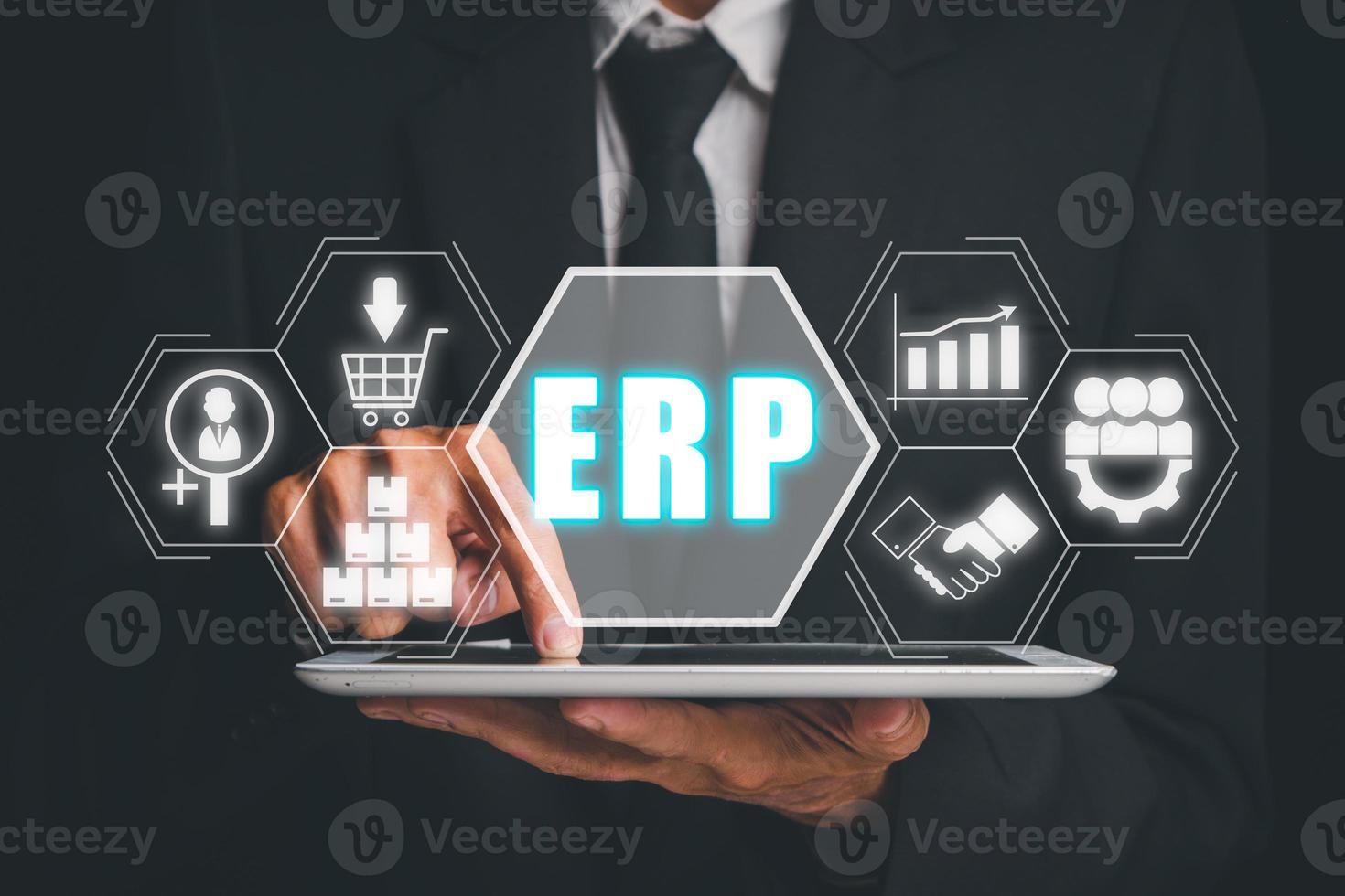 Enterprise Resource Planning ERP, document management concept with icons on virtual screen, Businessman working with digital tablet with Enterprise Resource Planning  icons on virtual screen . photo