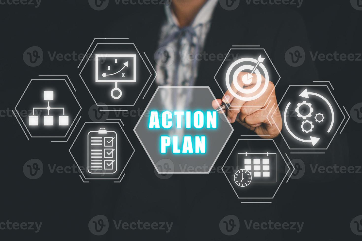 Action plan strategy vision planning direction concept, Business person hand touching action plan icon on VR screen. photo