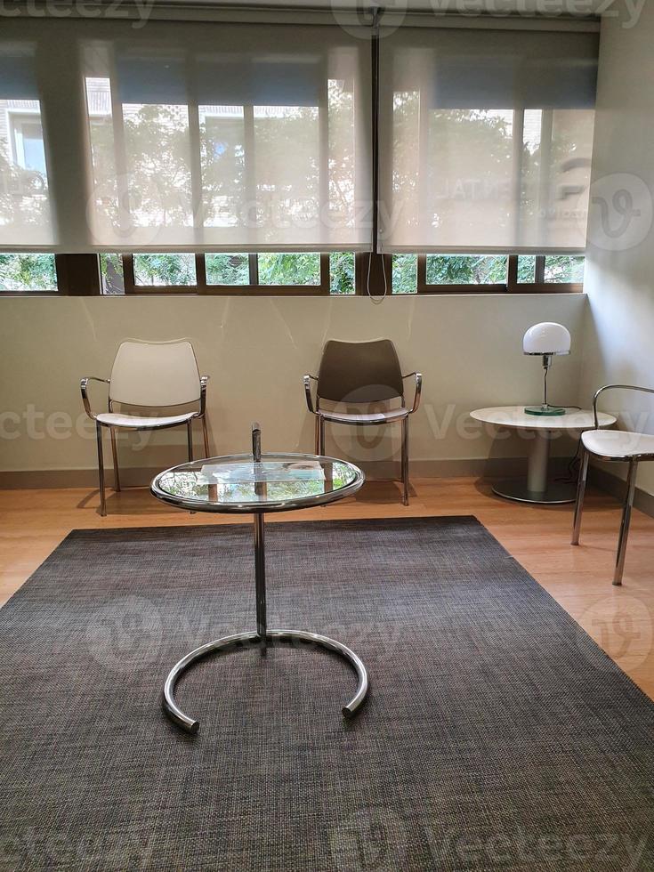 empty room waiting room with chairs and table photo