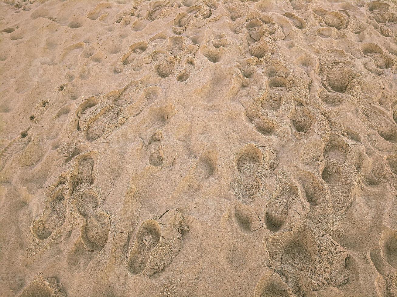 Close up beach texture Footprints on sand photo