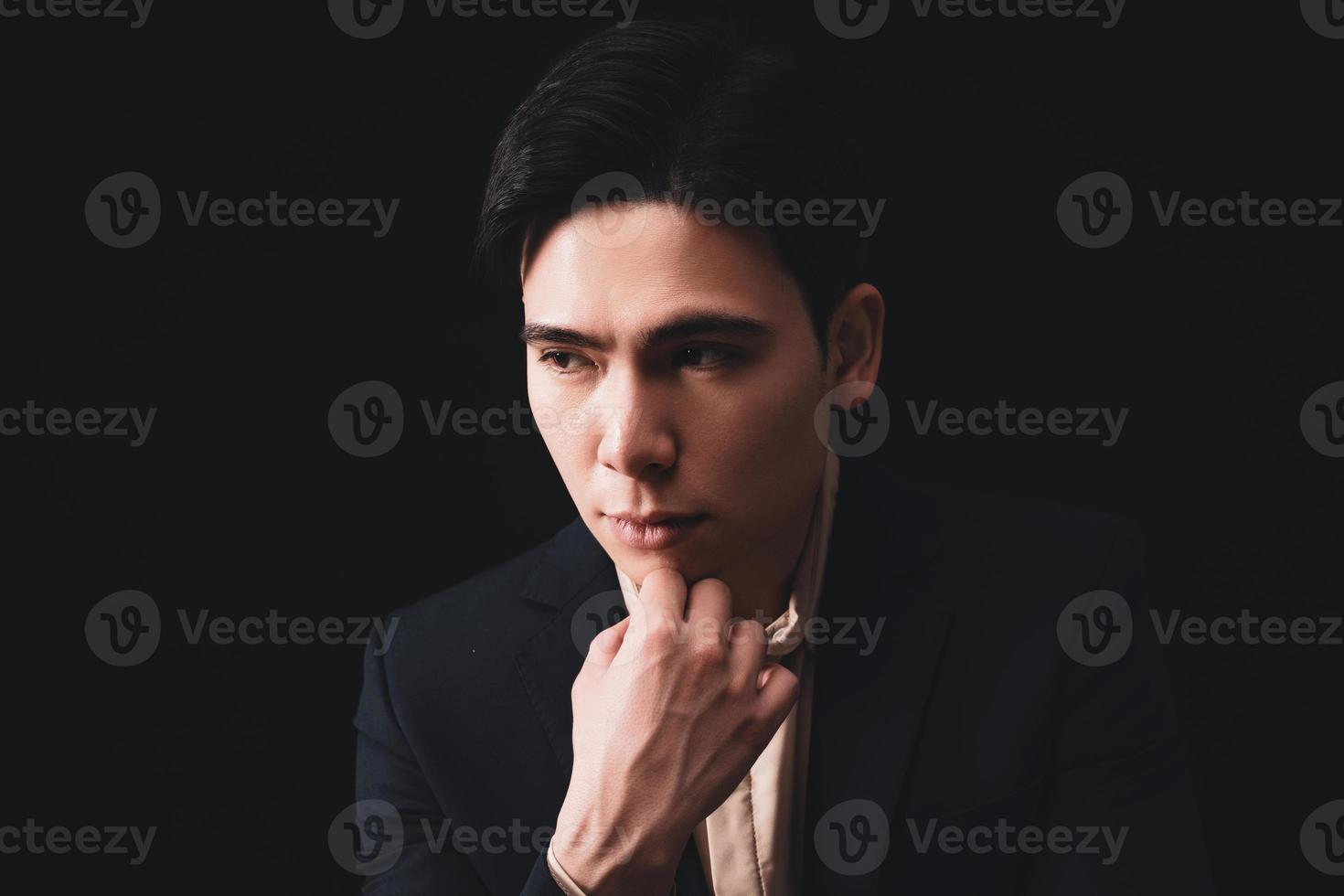 Photo of young Asian businessman on background