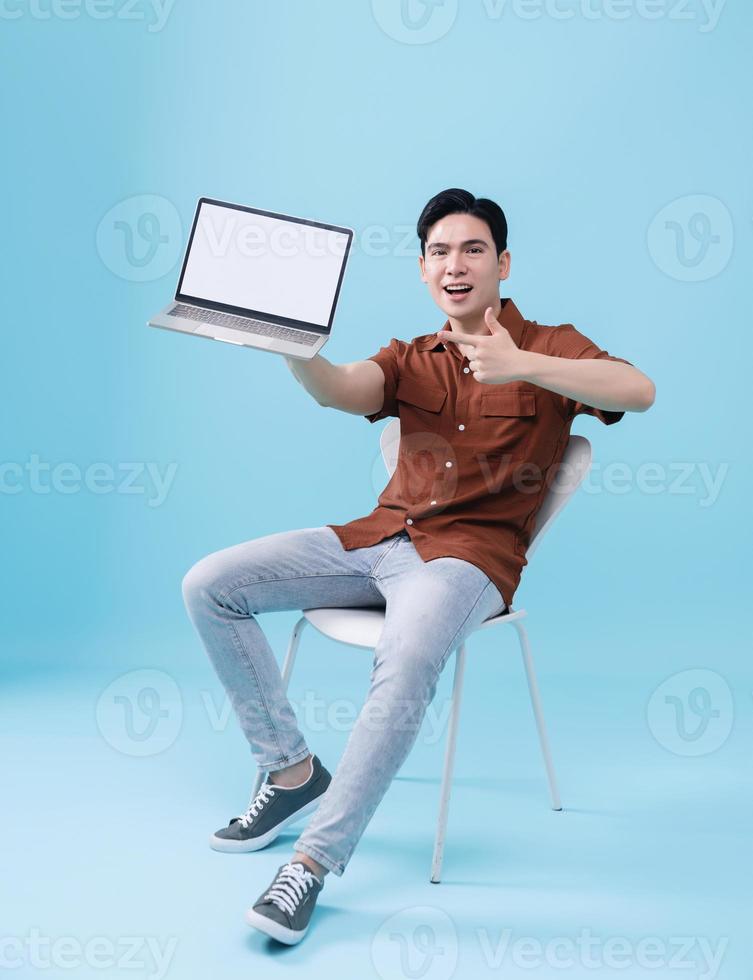 Image of young Asian man on background photo