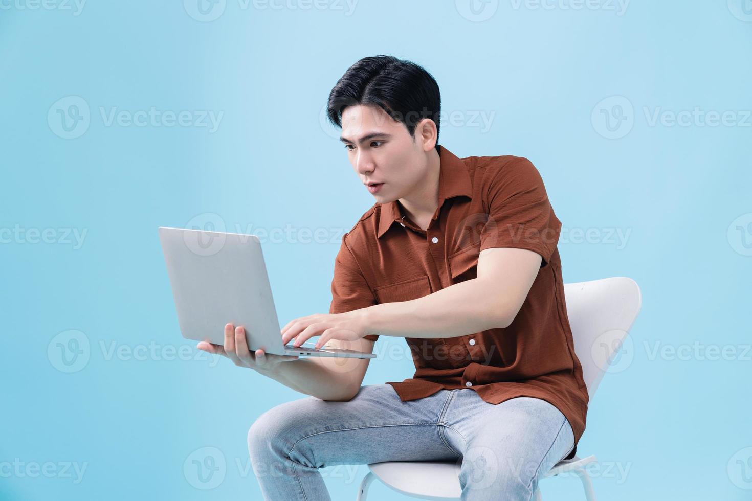 Image of young Asian man on background photo