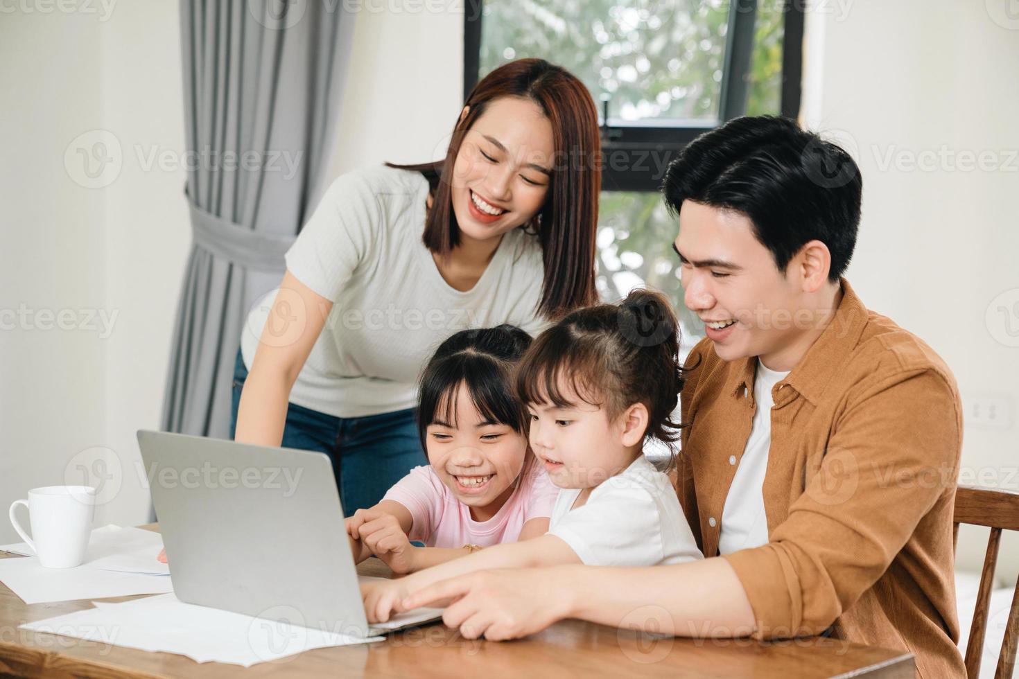 Young Asian family at home photo