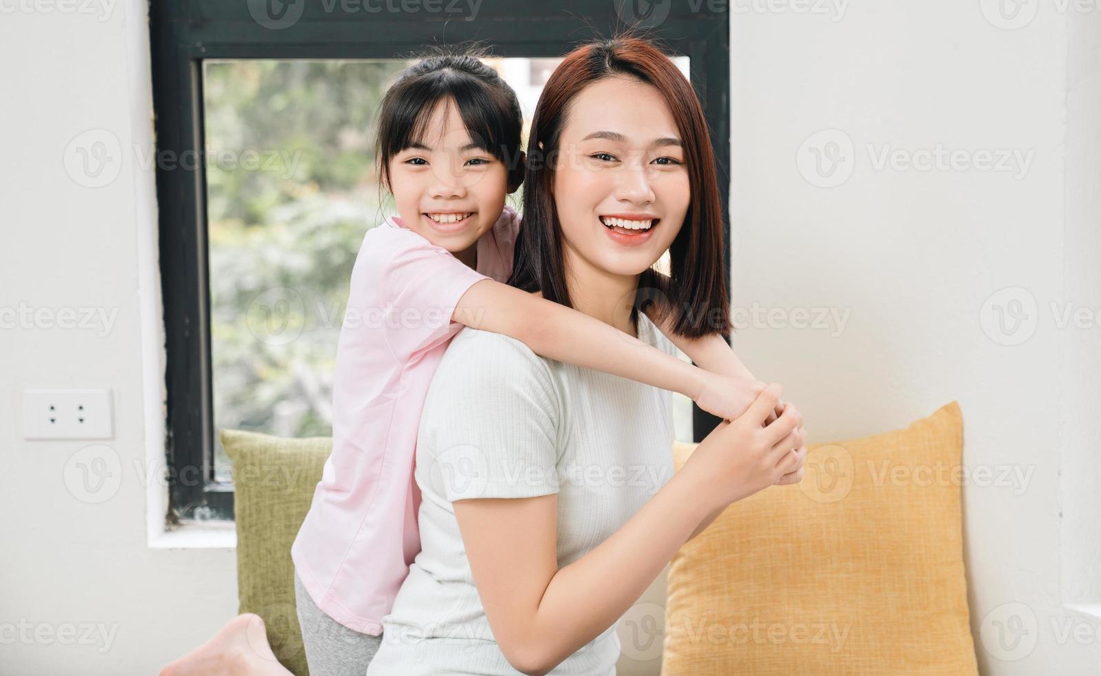 Image of young Asian mother and daughter at home photo