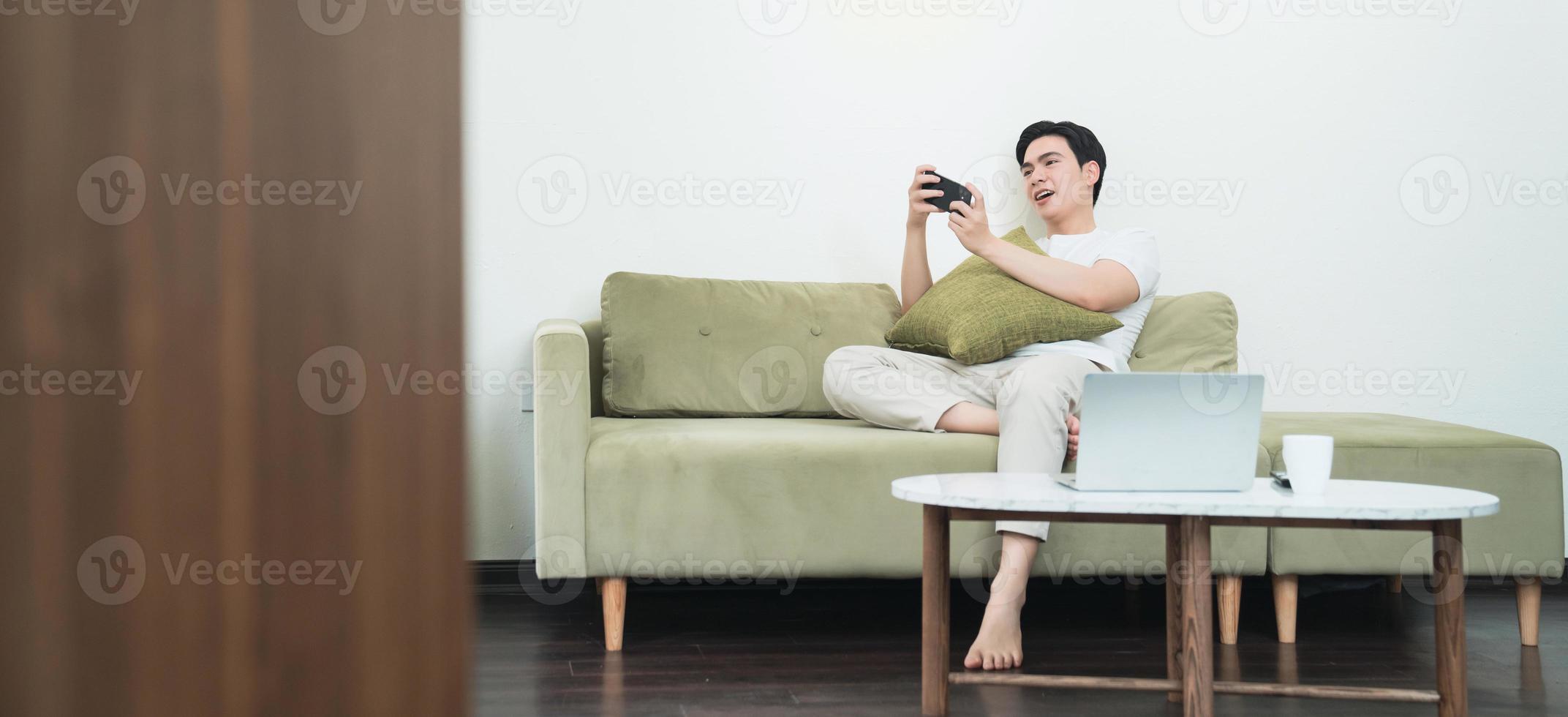 Image of young Asian man at home photo