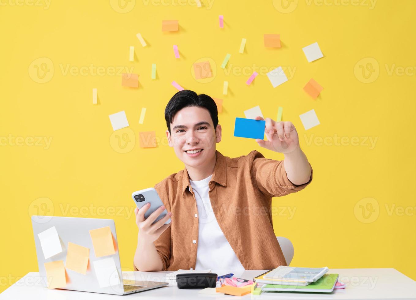Photo of young Asian businessman working on background