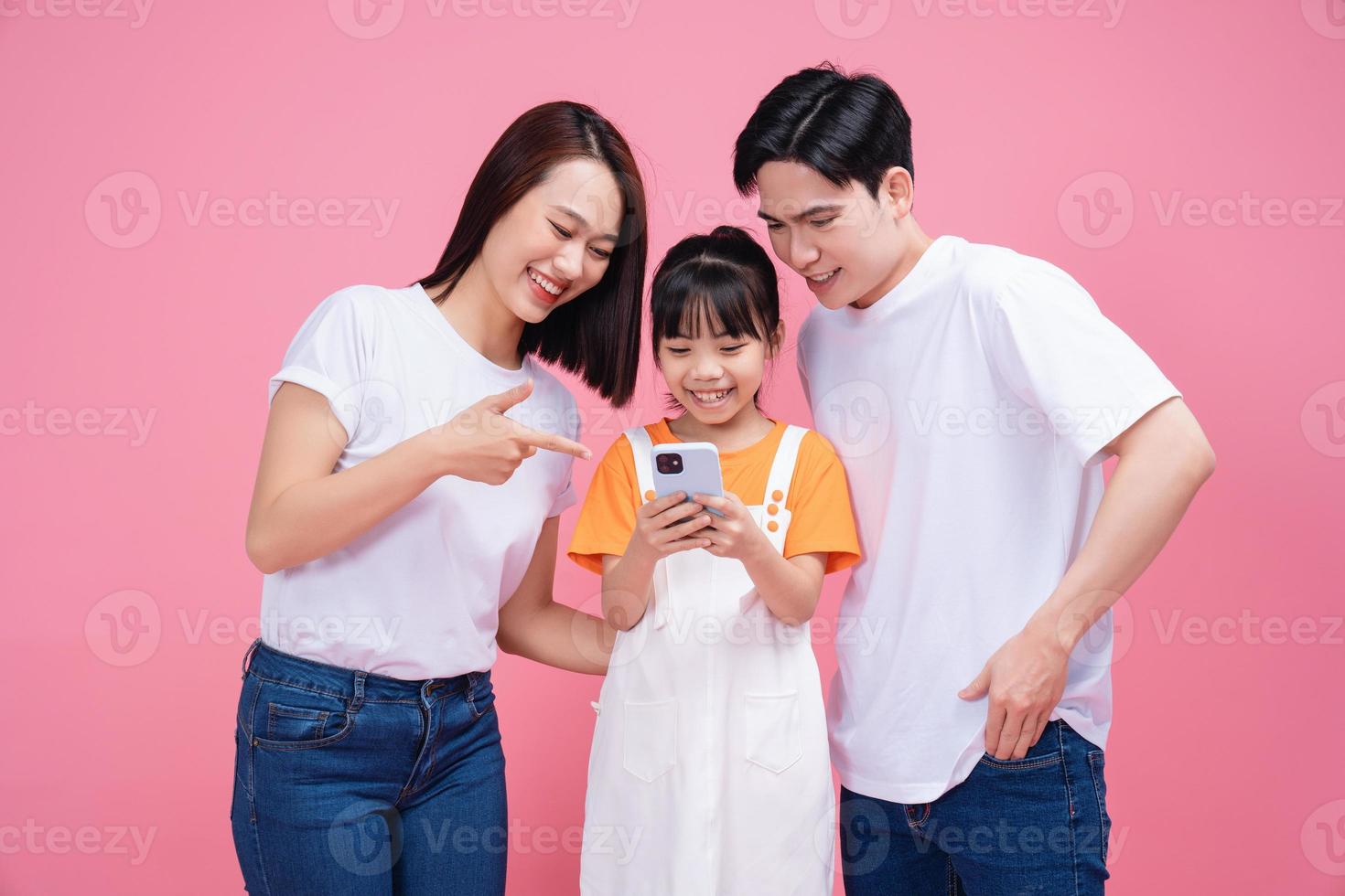 Young Asian family on background photo