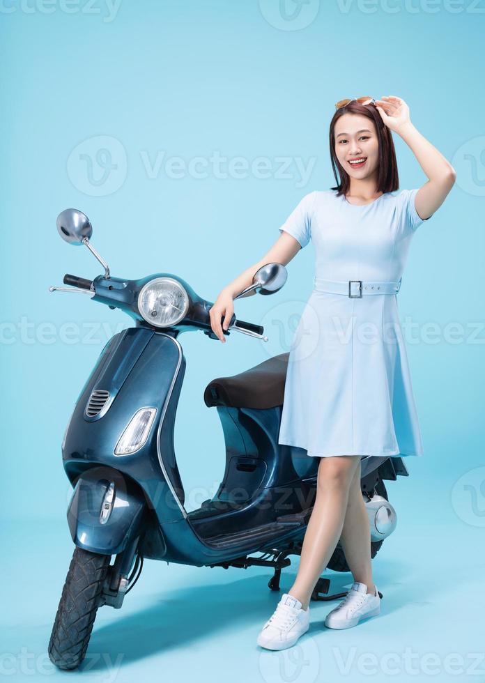 Young Asian woman on motorbike photo