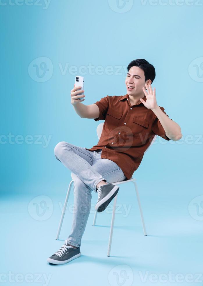 Image of young Asian man on background photo