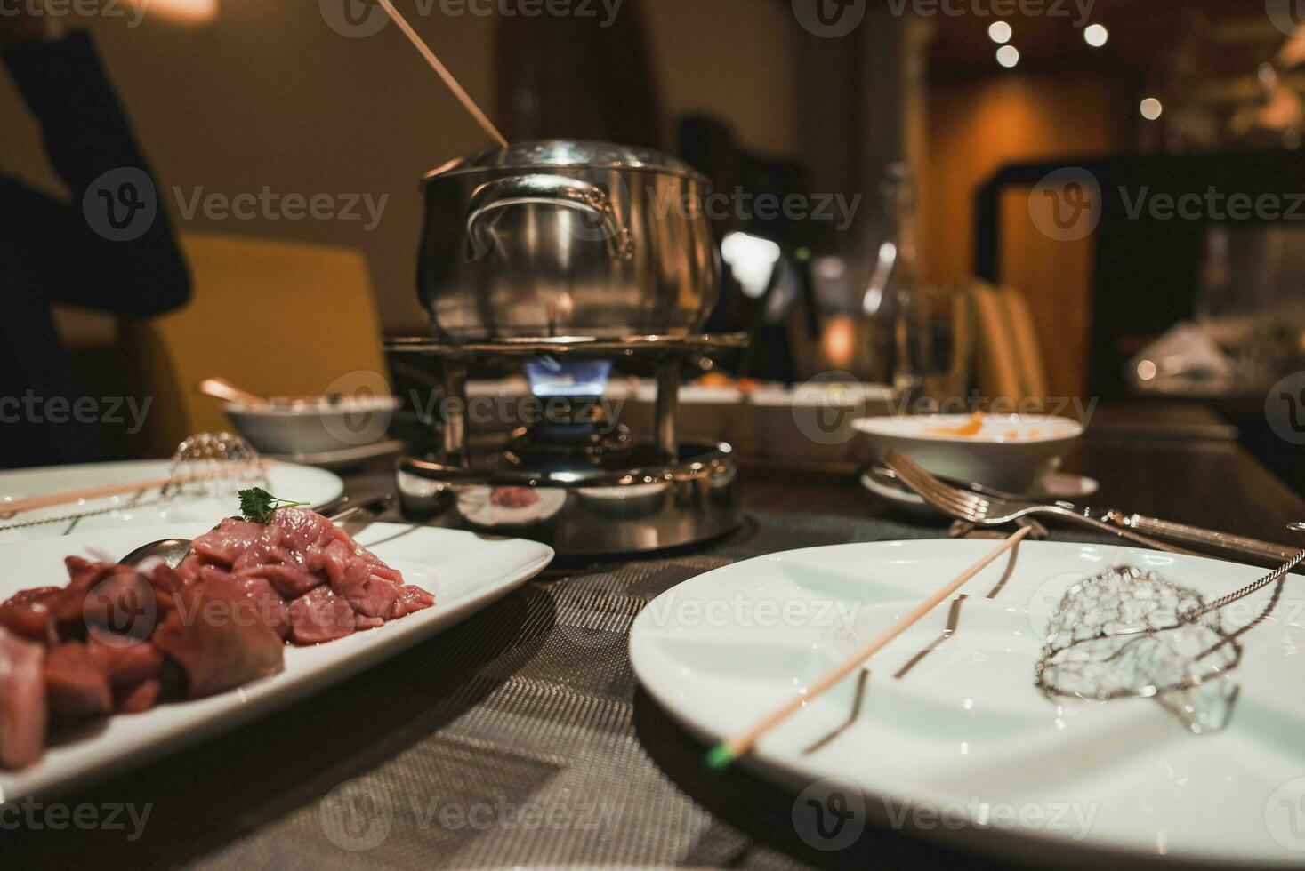 Closeup of food meat in plate at restaurant photo