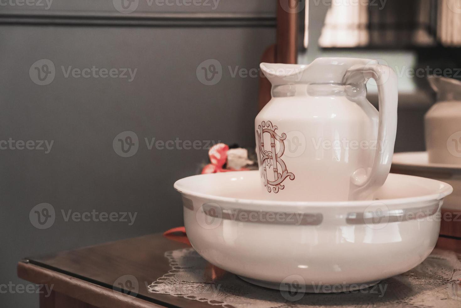 Jug in container kept on table in luxury hotel photo