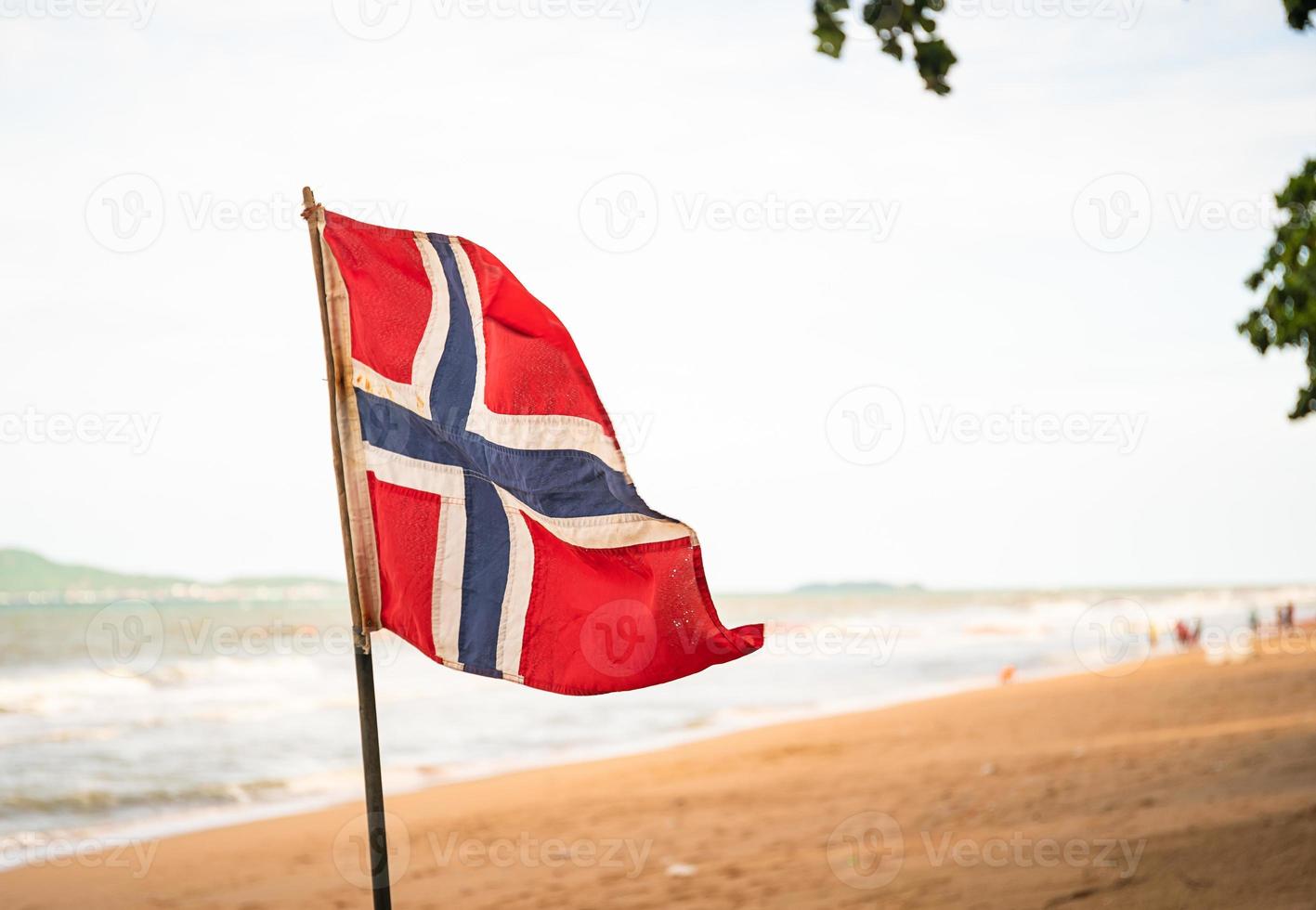 The Norwegian flag waving in the wind photo