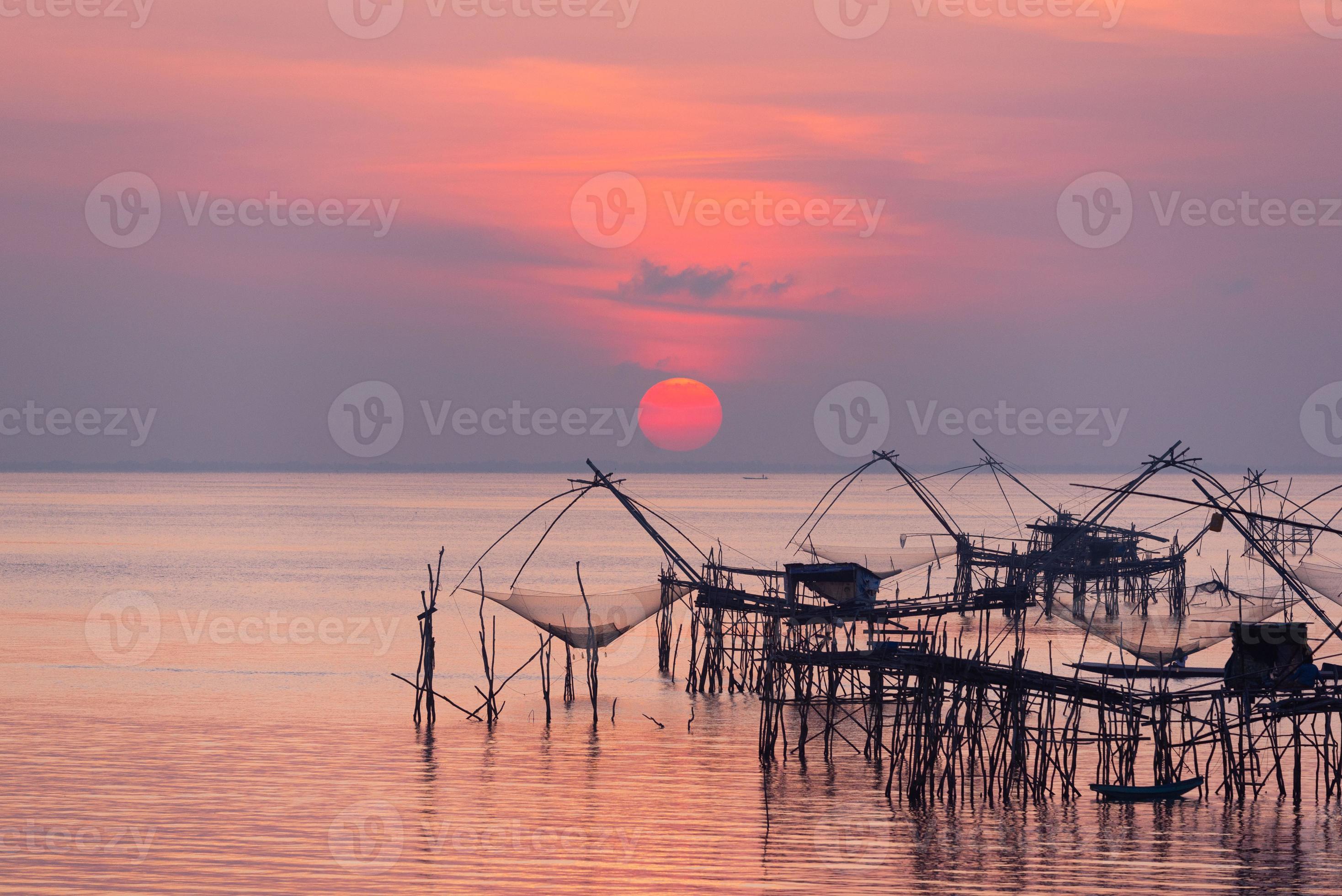 Scene of sunrise and giant fishing net 22508711 Stock Photo at Vecteezy