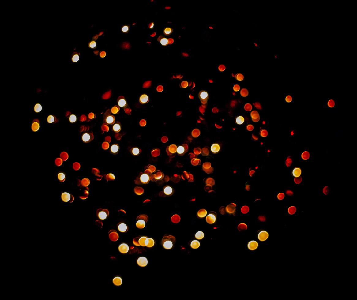 abstract bokeh background of golden light burst made from bokeh motion. photo